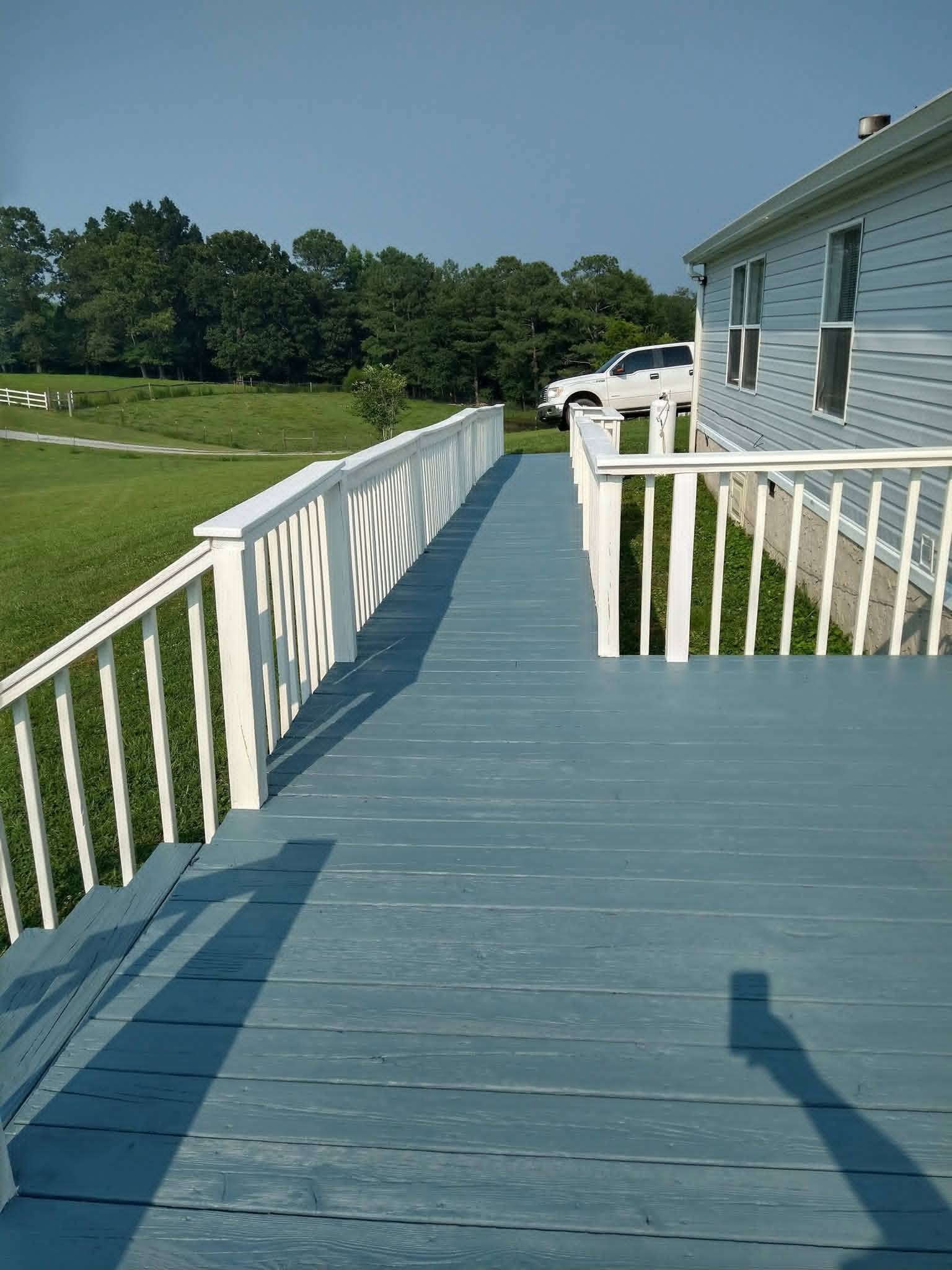 Same wooden ramp after restoration — clean wood finish